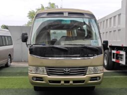 
										Toyota Coaster, a medium-sized bus full									