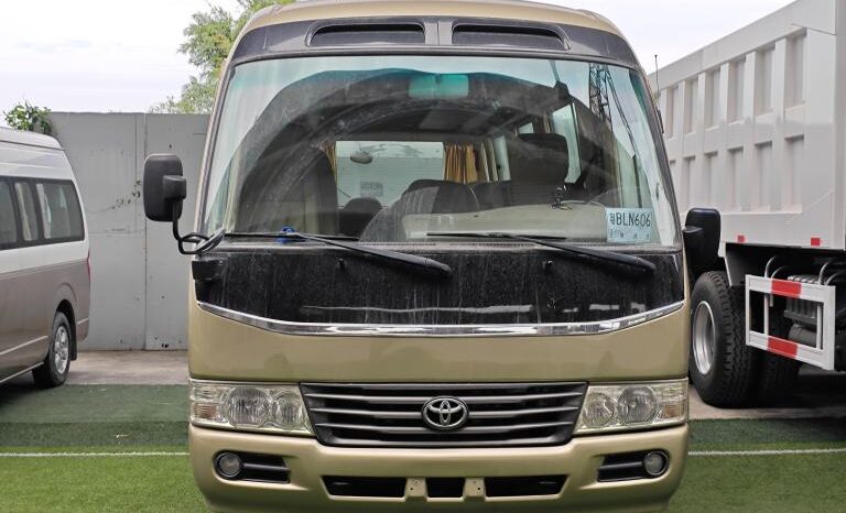 
								Toyota Coaster, a medium-sized bus full									