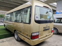 
										Toyota Coaster, a medium-sized bus full									