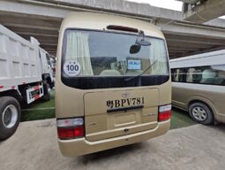 
										Toyota Coaster, a medium-sized bus full									