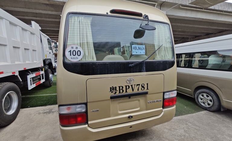 
								Toyota Coaster, a medium-sized bus full									