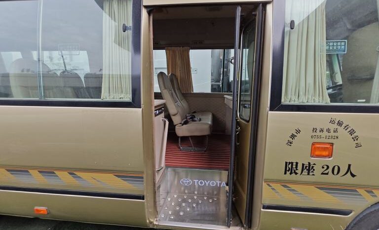 
								Toyota Coaster, a medium-sized bus full									