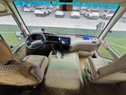 
										Toyota Coaster, a medium-sized bus full									